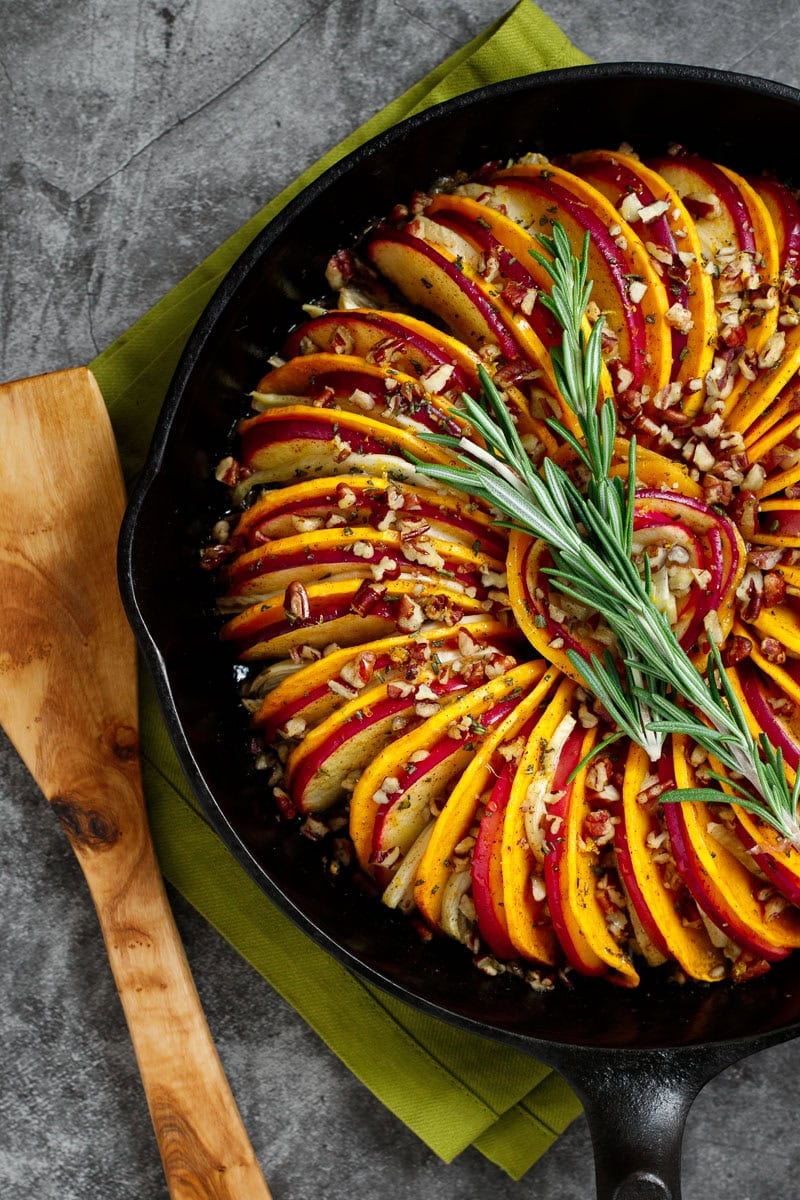 Apple and butternut squash tian, garnished with rosemary sprigs.