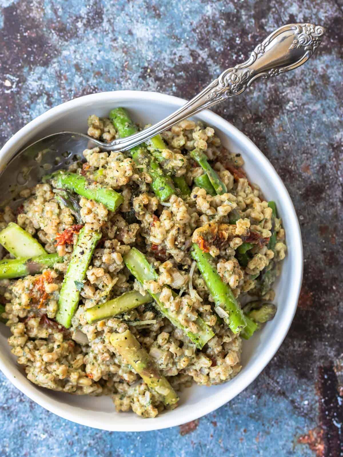 a bowl of farrotto with a spoon
