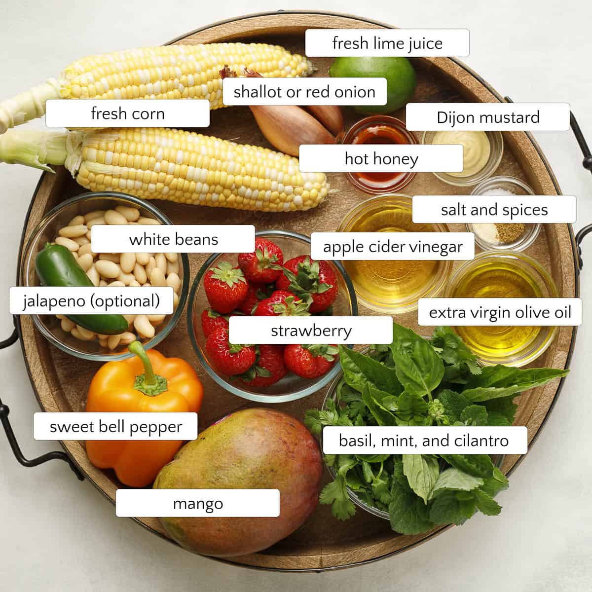 Ingredients for Cowgirl Caviar include mango, strawberry, lime, and white beans.