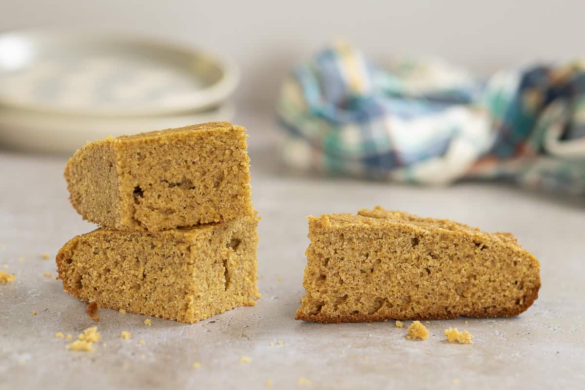 this image shows the difference between cakey, soft cornbread on the left, and grainy, dense cornbread on the right. The bread on the right is notably more grainy and clearly didn't rise as much as the cakier version on the left.