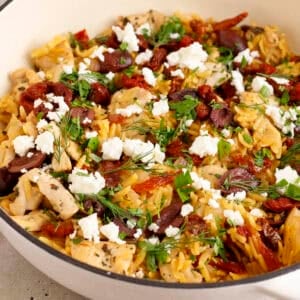 Mediterranean chicken skillet one pan meal in a pan ready to serve.