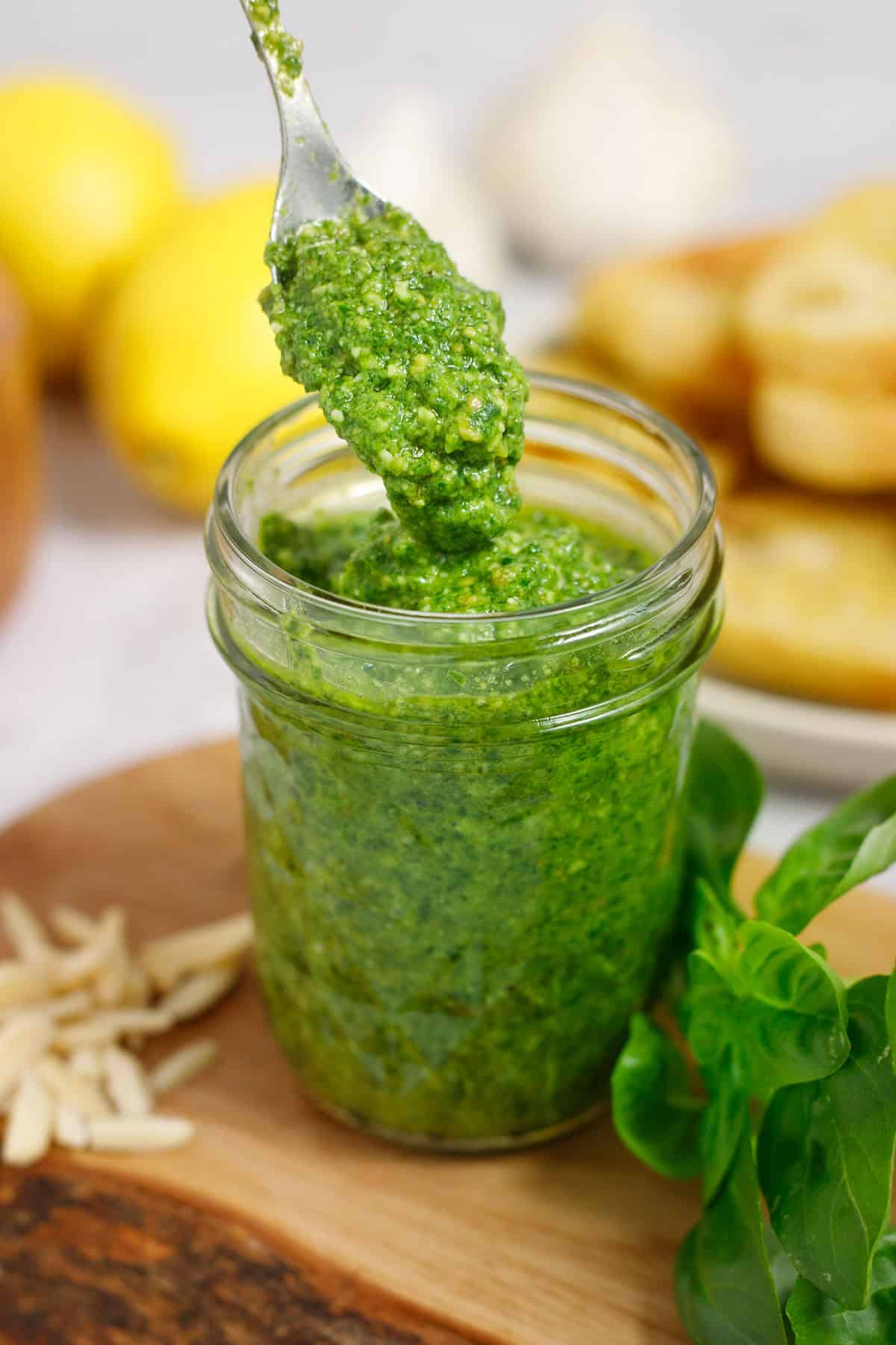 basil pesto with almond and lemon in a glass jar. 