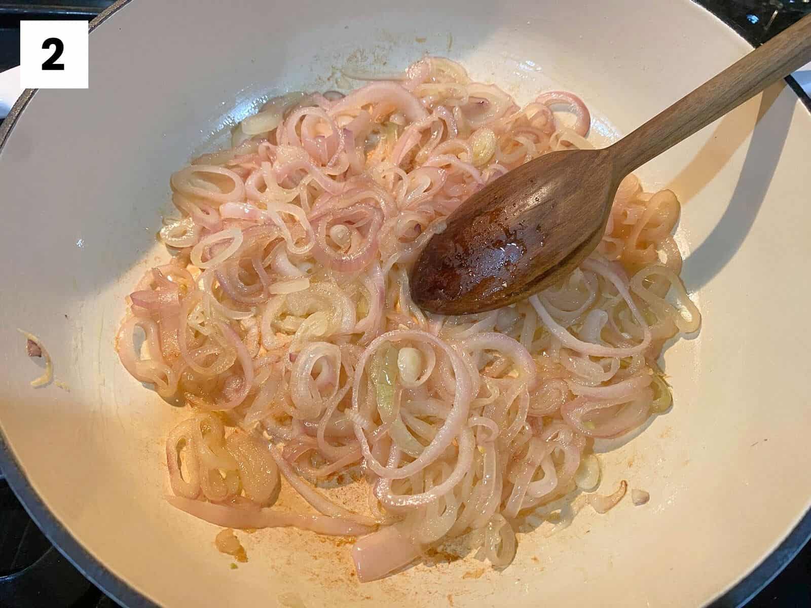 Step 2 of this butternut squash tian recipe: saute shallots in olive oil and add to the bottom of your baking pan.