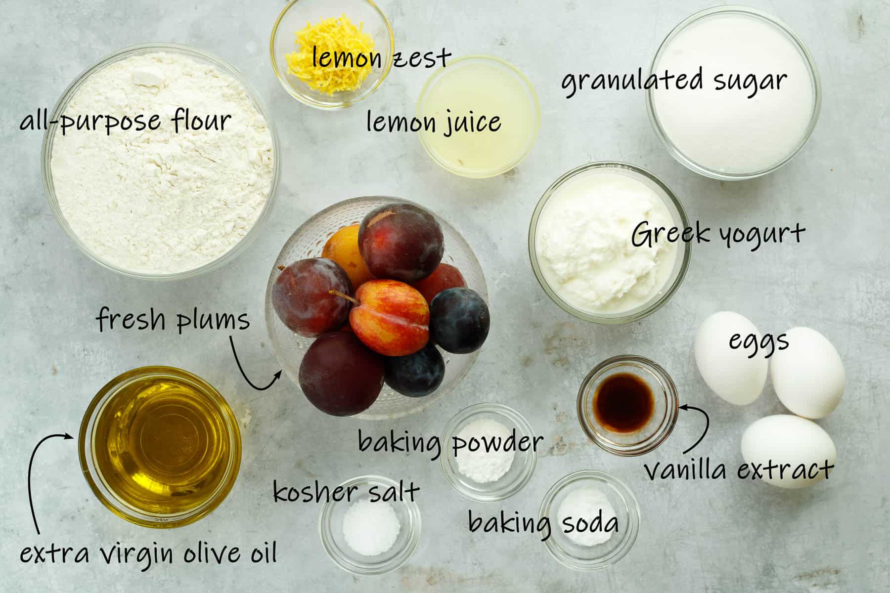 Ingredients for lemon olive oil cake with plums. 