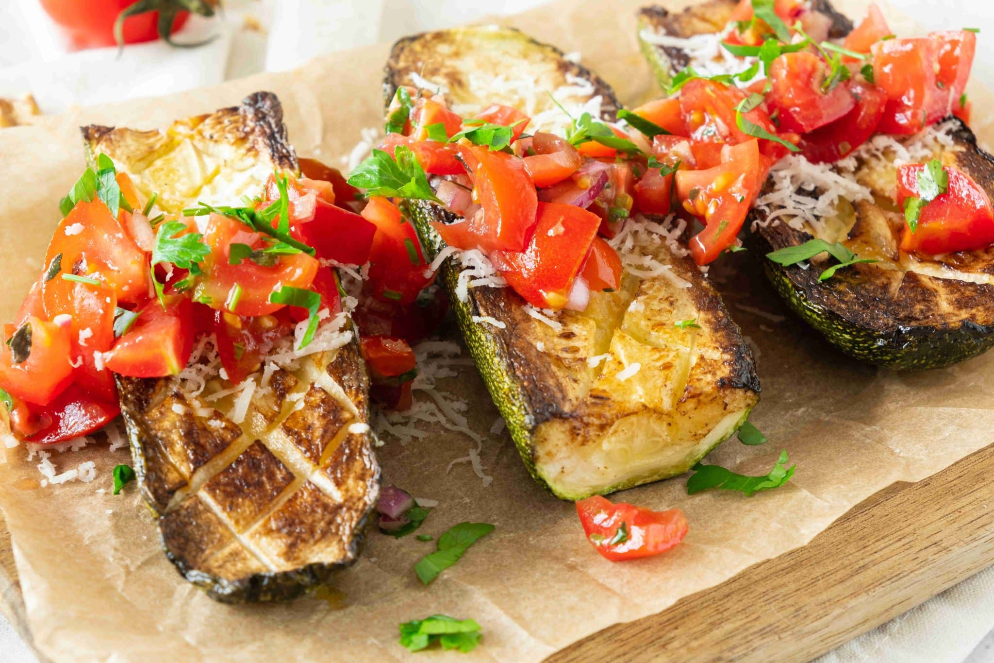 Mediterranean baked zucchini topped with cherry tomatoes