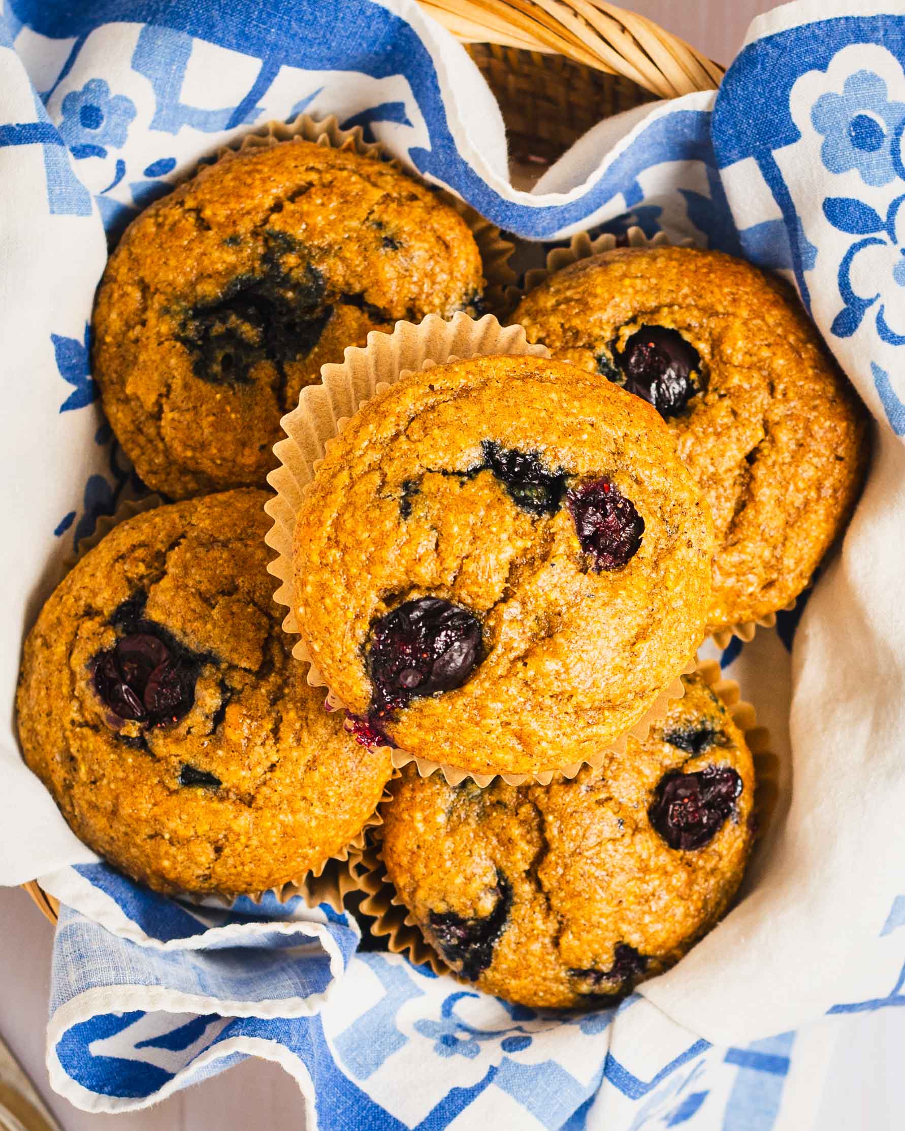 banana blueberry muffins in a basket.